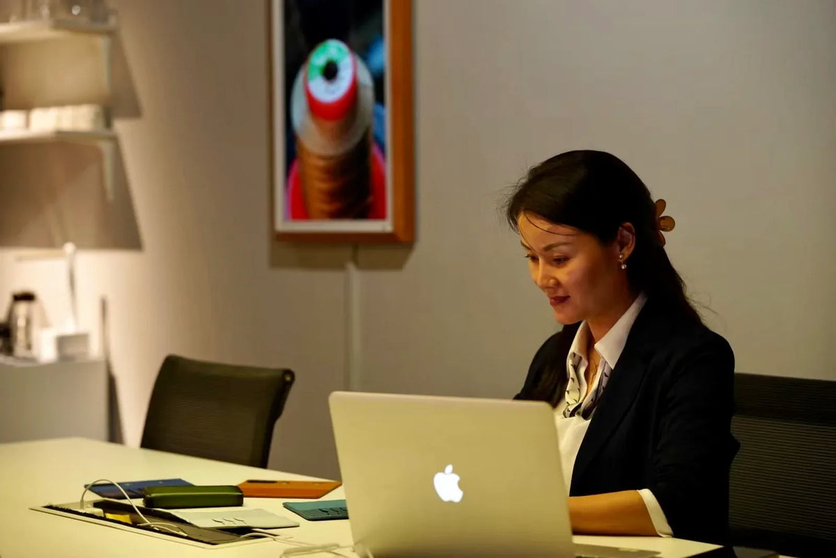 Yan Wu working at her desk
