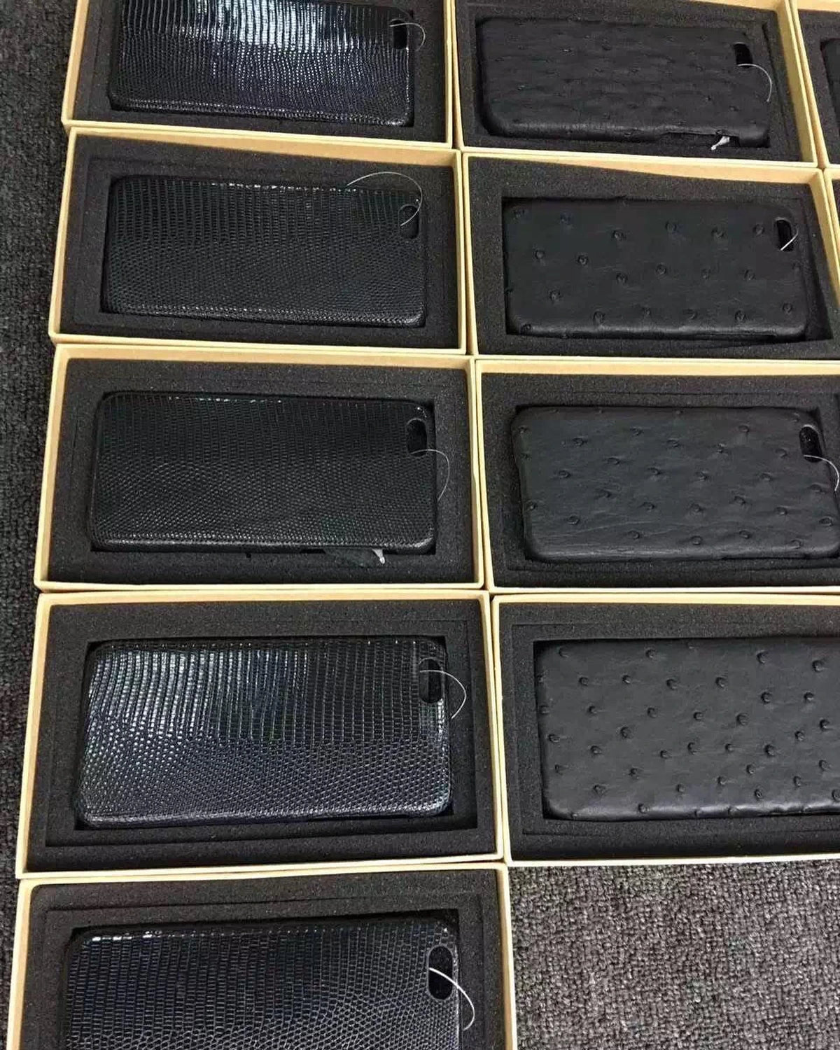 Lizard and ostrich leather phone cases in presentation boxes from Aarons Leather production