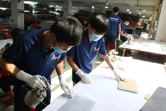 Aarons Leather production team preparing leather components in the workshop