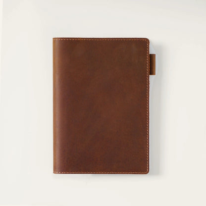 Brown A6 top-grain crazy horse leather notebook cover, closed front view