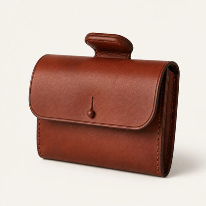 Leather saddle pommel bag shown from a side three-quarter angle