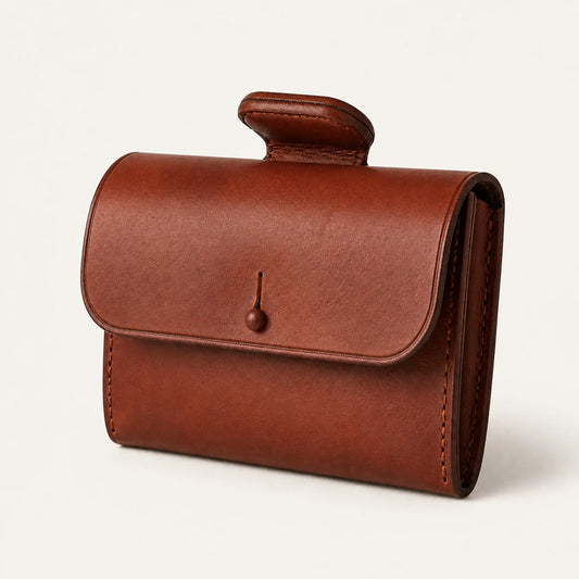 Leather saddle pommel bag shown from a side three-quarter angle