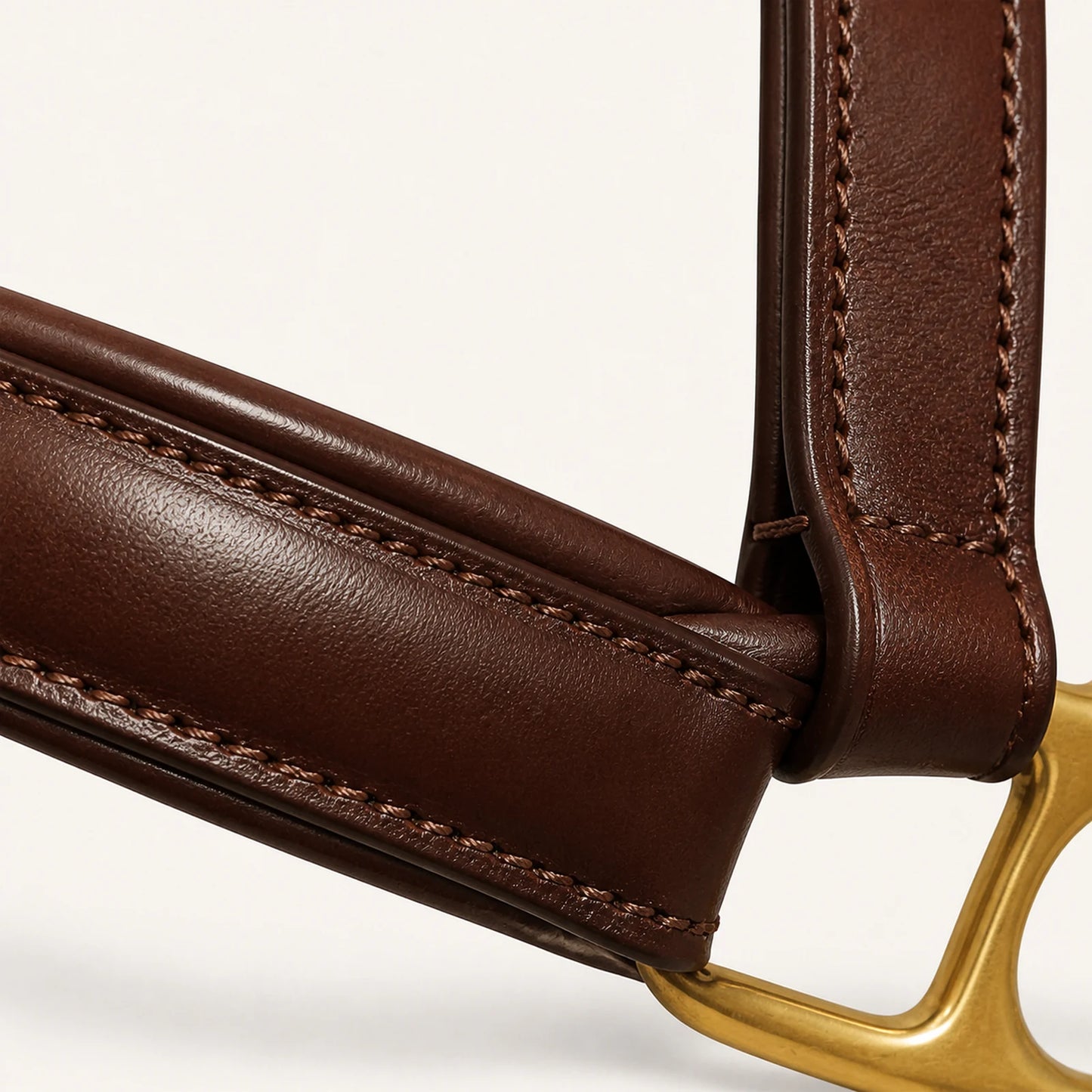 Close-up of padded leather halter noseband and saddle stitching