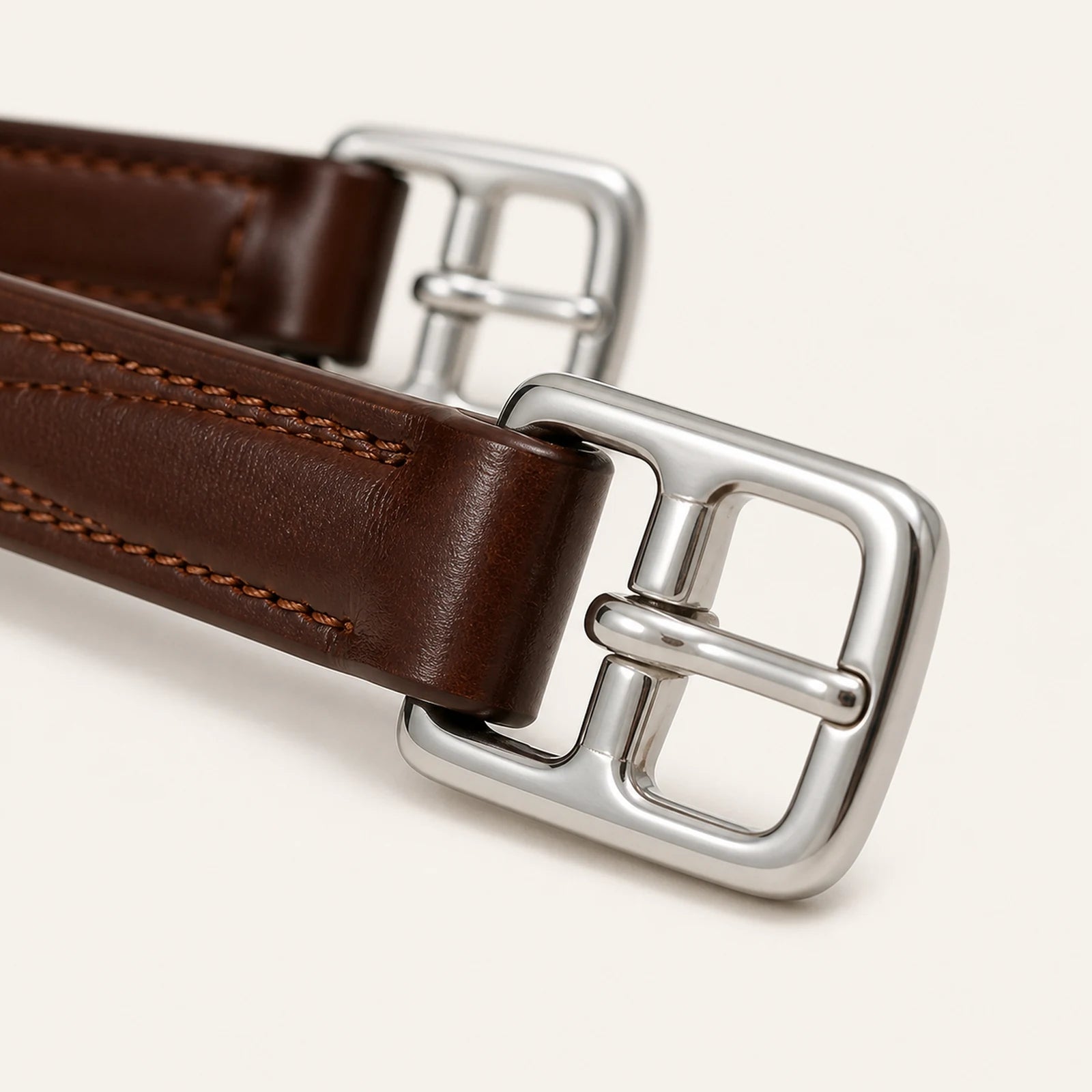 Close-up of stainless roller buckle and reinforced leather tab