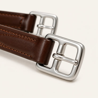 Close-up of stainless roller buckle and reinforced leather tab