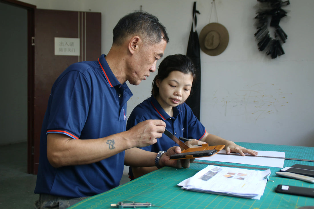 Aarons Leather team reviewing a leather product sample