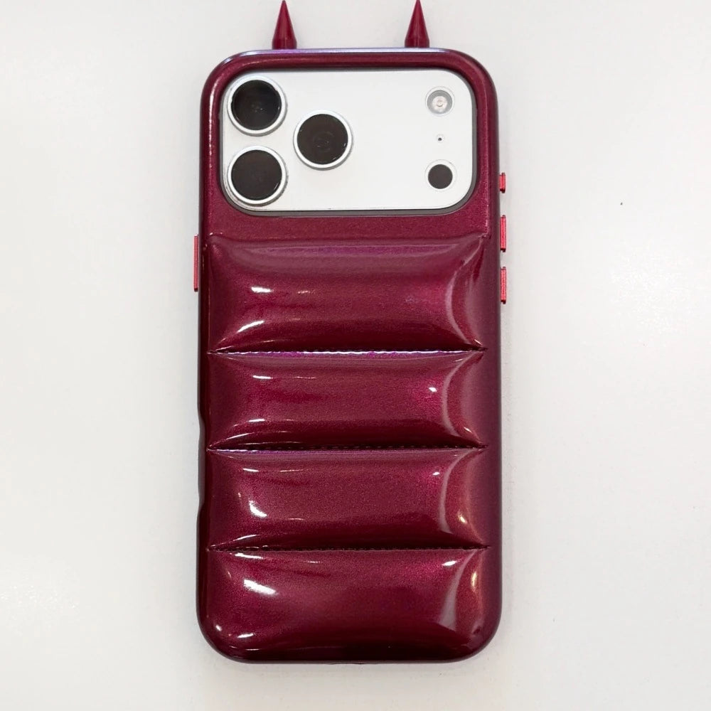 Burgundy Horns puffer-style phone-case reference with two pointed top details.