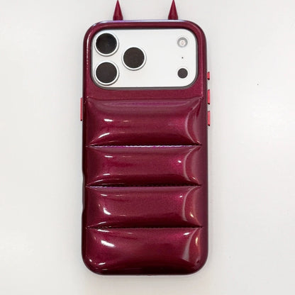Burgundy Horns puffer-style phone-case reference with two pointed top details.