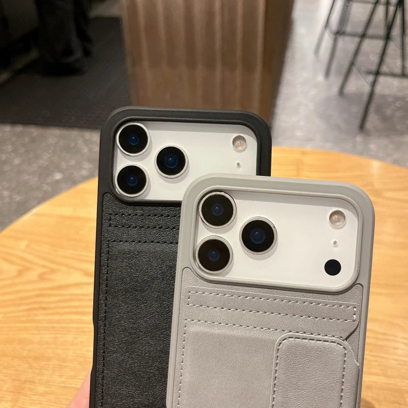 Black and gray card-holder surfaces, stitching and phone-case camera openings.