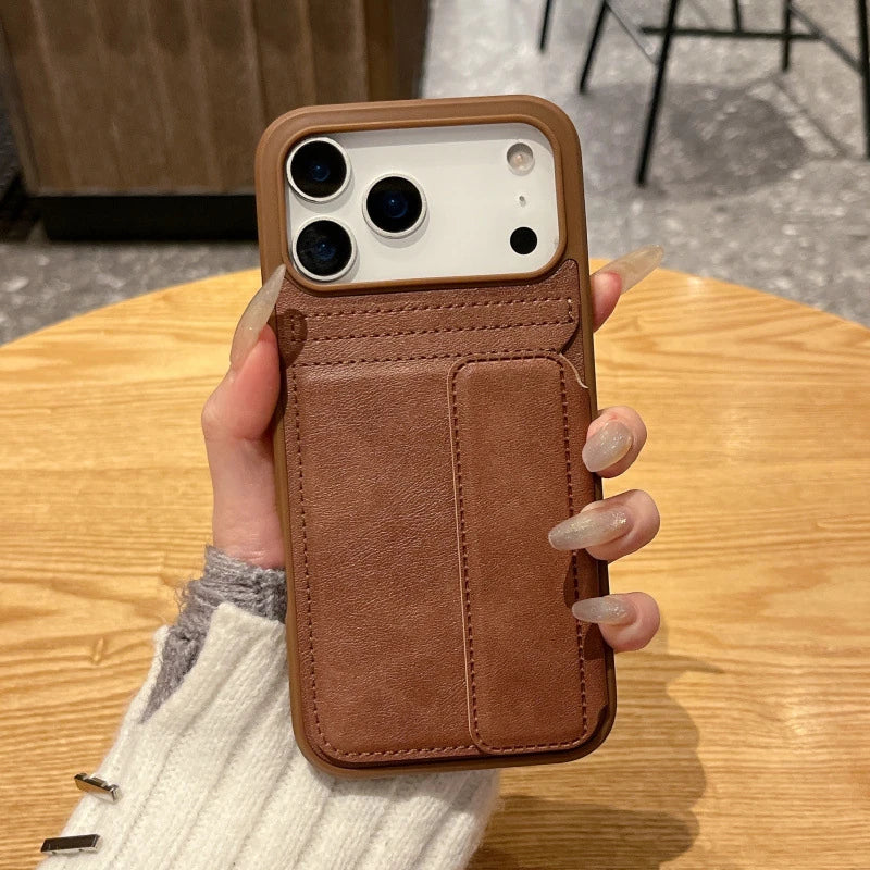 Brown-tone wallet phone case held in a hand as a design reference.