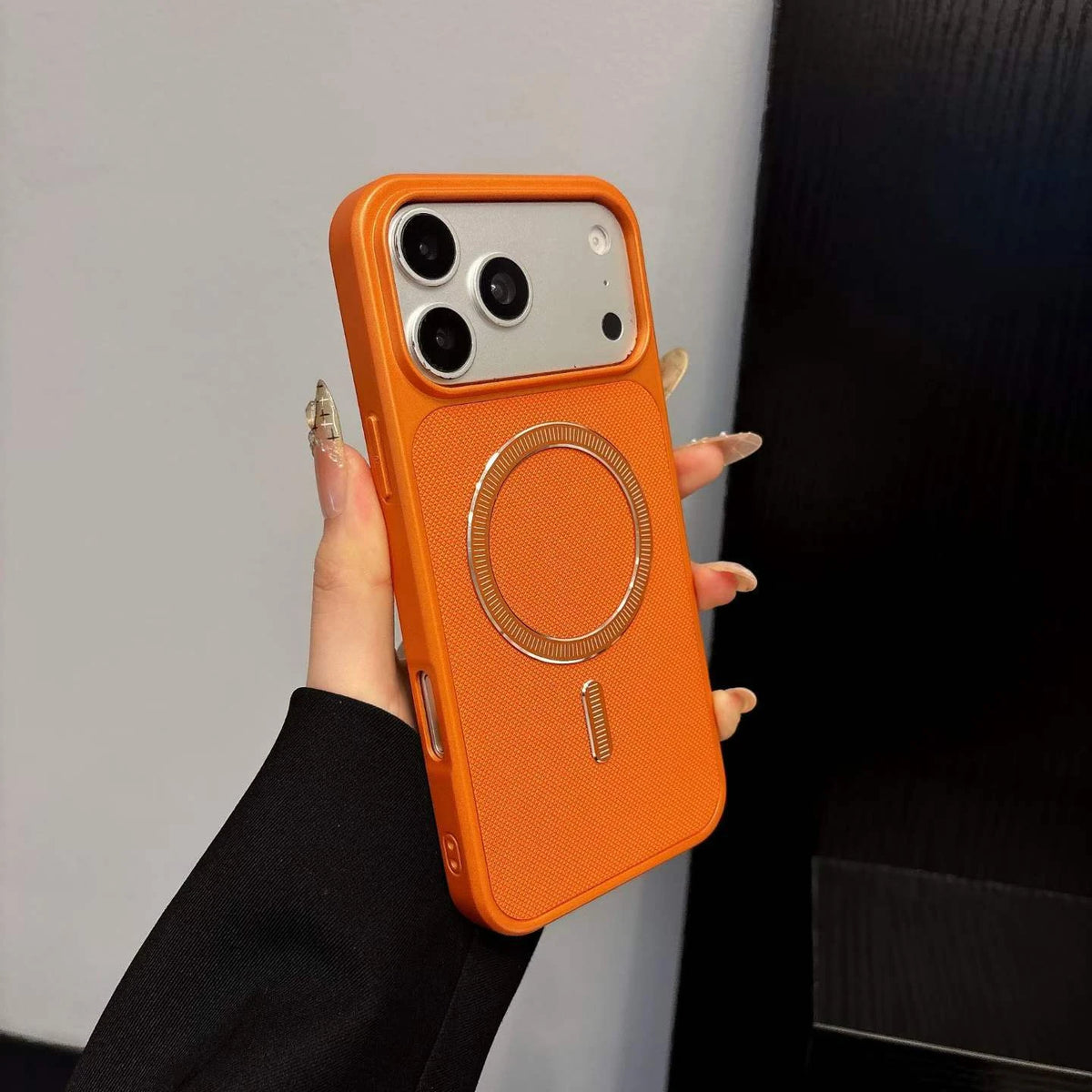 Orange textured TPU case held on a display phone; phone not included.