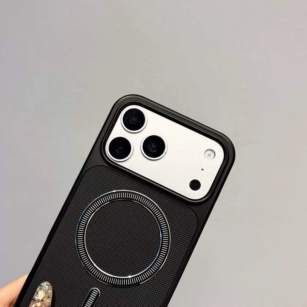 Black surface texture and camera-frame detail of the TPU case.