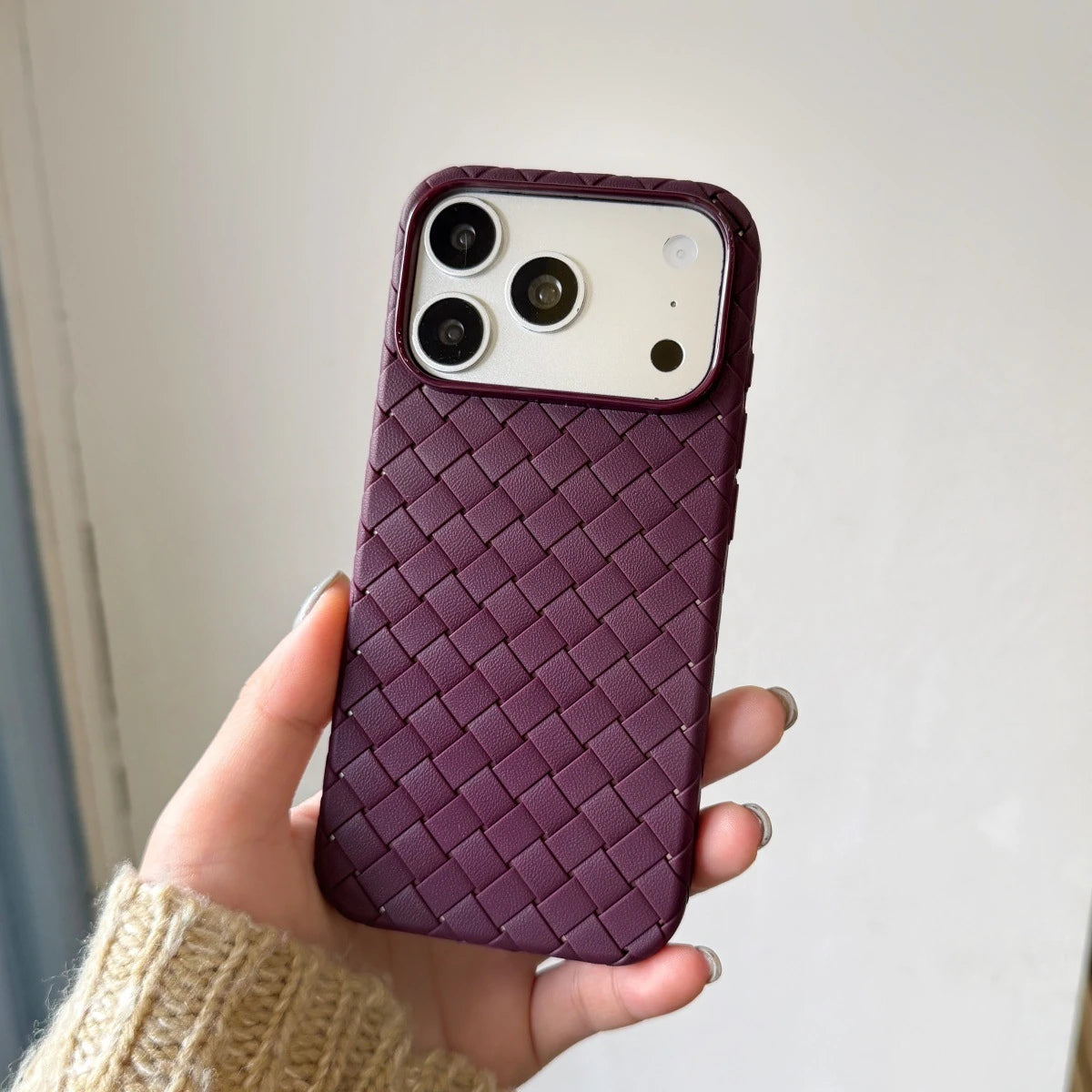 Purple basketweave-texture phone case held as a shared design reference.