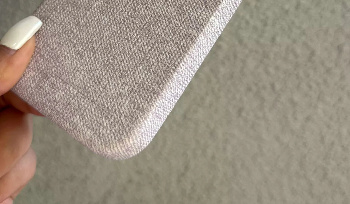 Lower corner and edge detail of the woven-texture PU phone-case design.