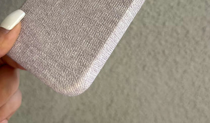 Lower corner and edge detail of the woven-texture PU phone-case design.