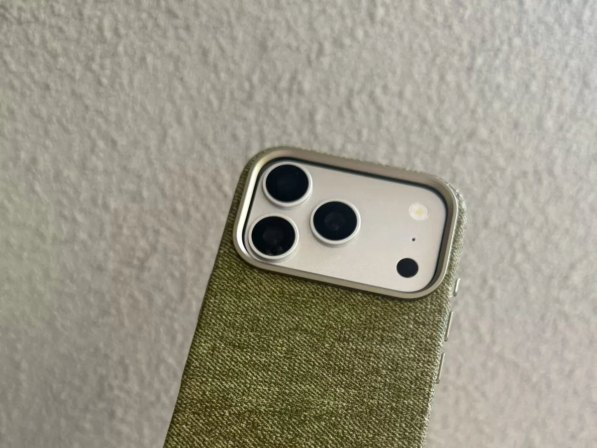 Green woven-texture PU case camera-frame close-up.