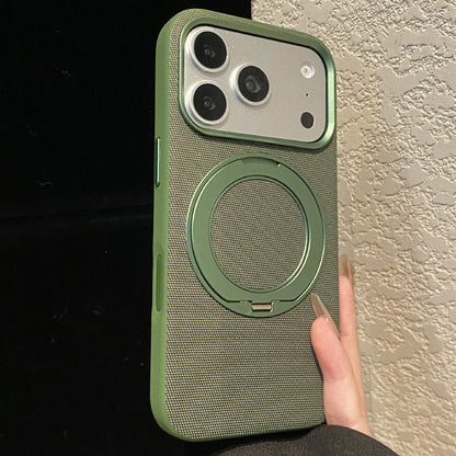Green textile-finish phone-case style reference with circular rear stand.