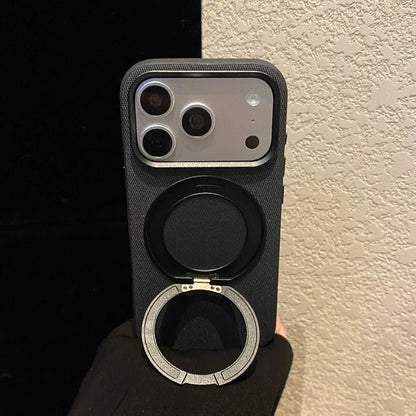 Black phone case with the ring stand opened in a portrait position.