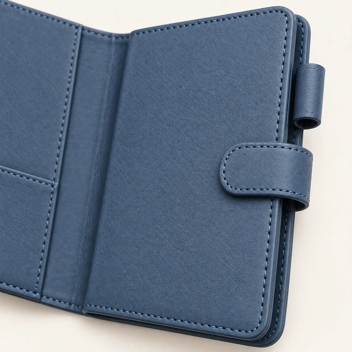 Slate blue A6 leather notebook cover, side-tab, pen-loop and stitched-edge detail