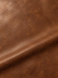 Brown surface with irregular fine grain, creases and a broad diagonal fold