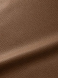 Brown surface with a closely packed rounded pebble texture