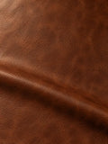 Warm brown grained surface with darker shading around a broad fold
