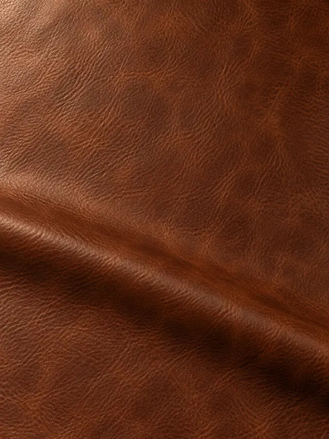 Warm brown grained surface with darker shading around a broad fold
