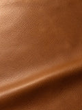 Smooth brown surface with fine grain, a soft sheen and a diagonal fold
