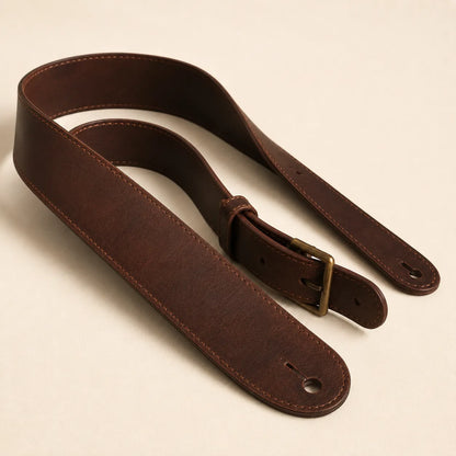 Angled view of classic leather guitar strap with adjustable structure