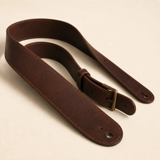 Angled view of classic leather guitar strap with adjustable structure