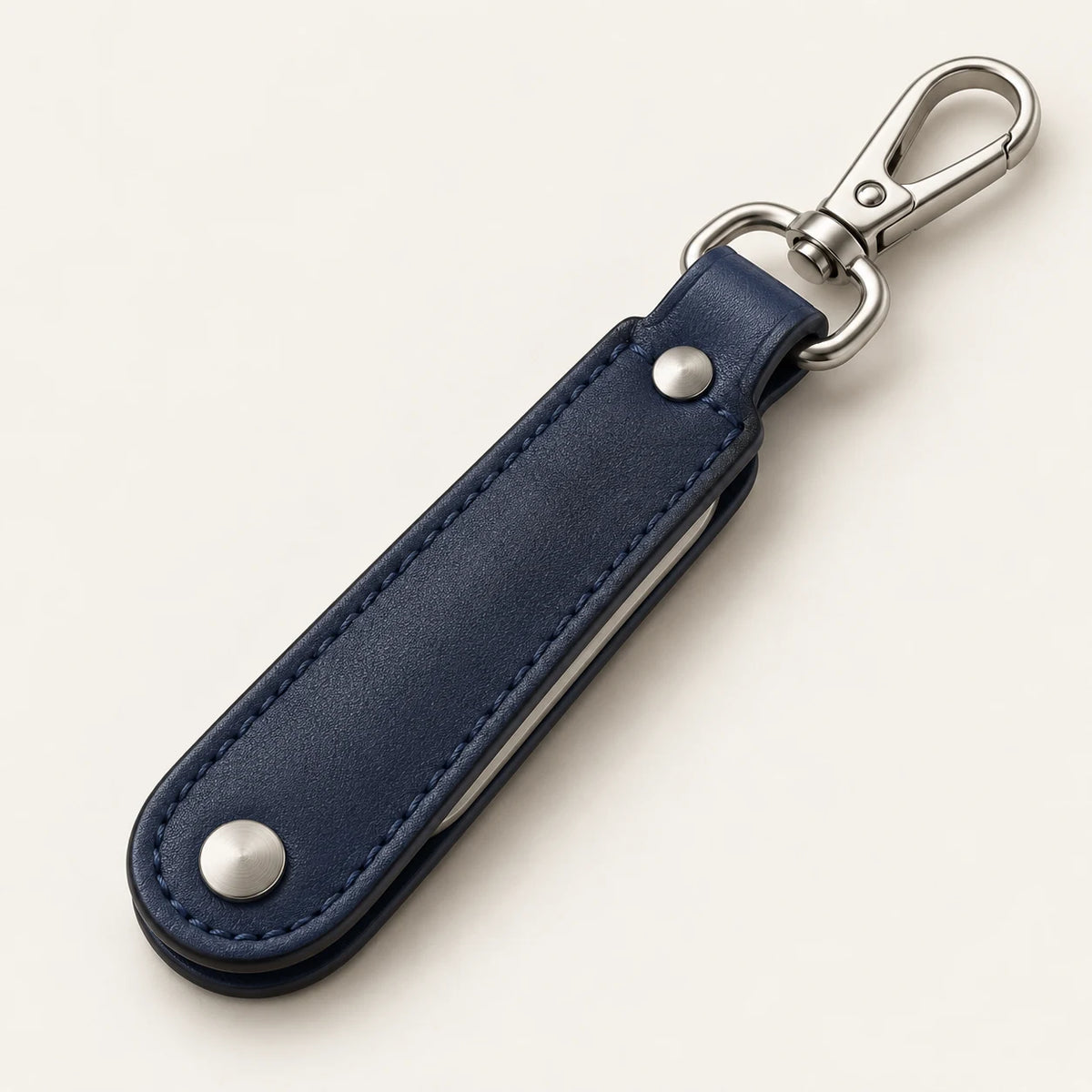 Closed navy leather folding bottle opener keyring with silver-tone swivel spring clip