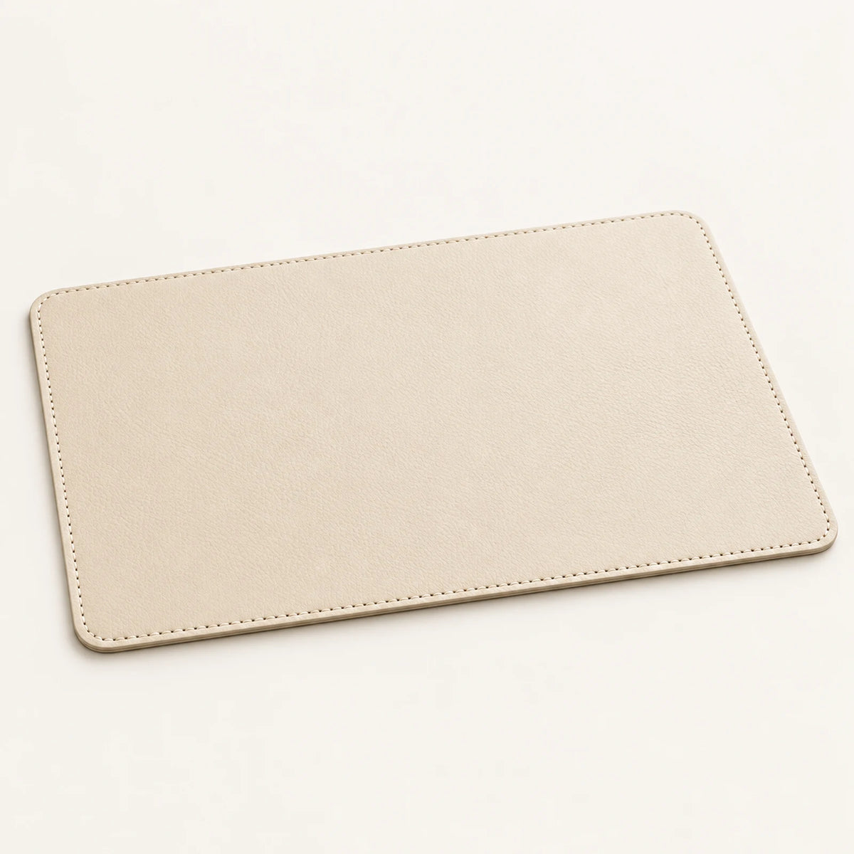 Custom genuine cowhide hotel tray mat in soft stone cream with stitched rounded corners
