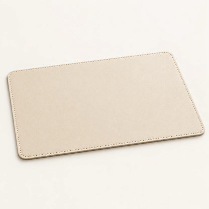 Custom genuine cowhide hotel tray mat in soft stone cream with stitched rounded corners