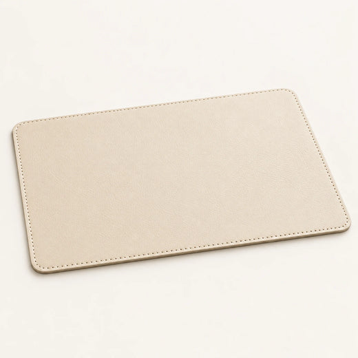 Custom genuine cowhide hotel tray mat in soft stone cream with stitched rounded corners