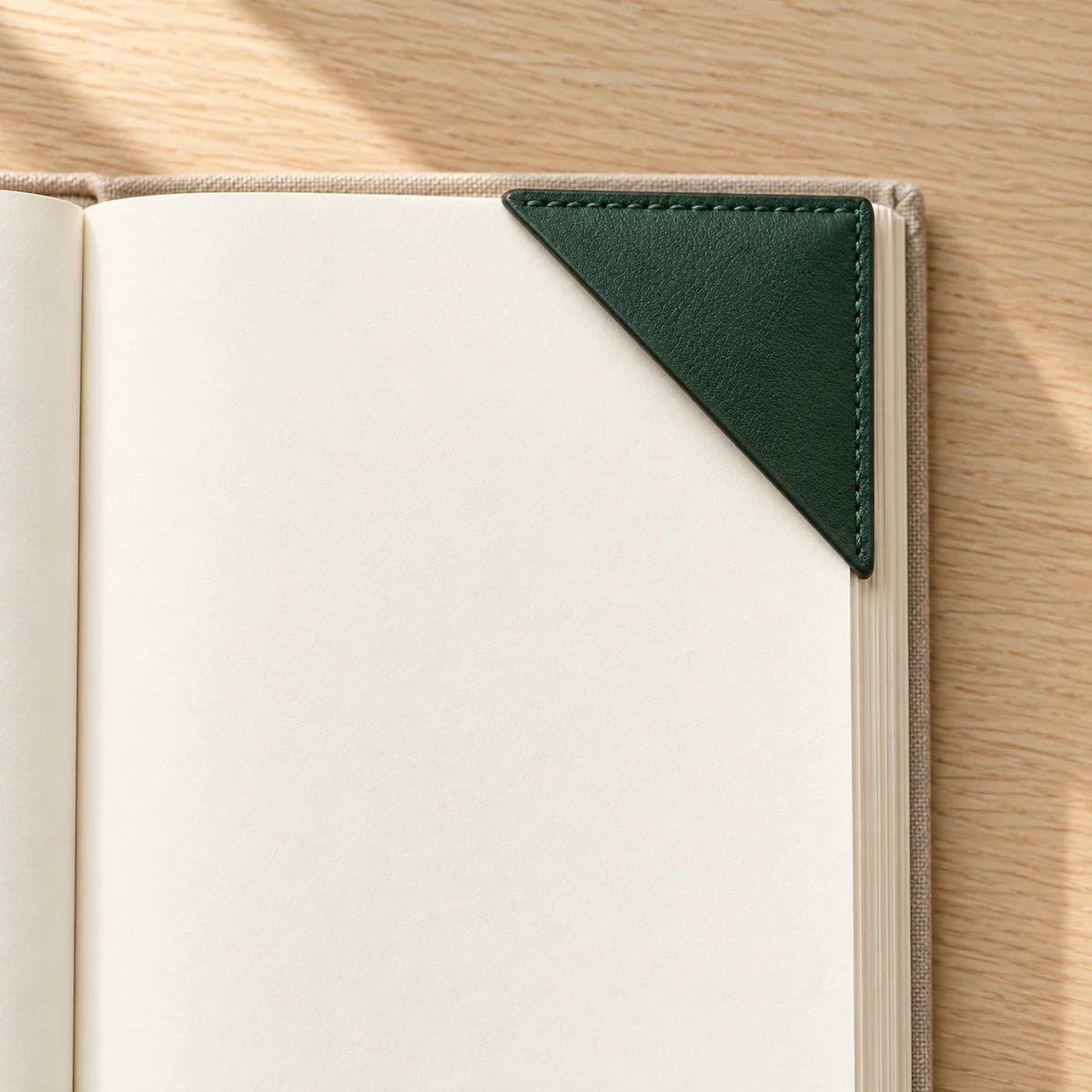 Green leather corner bookmark in a reading scene; book is not included