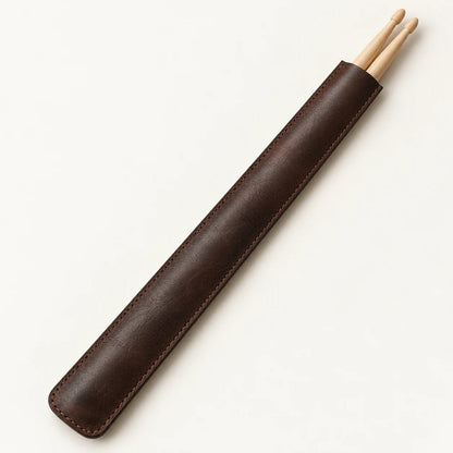 Dark-brown leather drumstick sleeve with one selected pair shown for fit