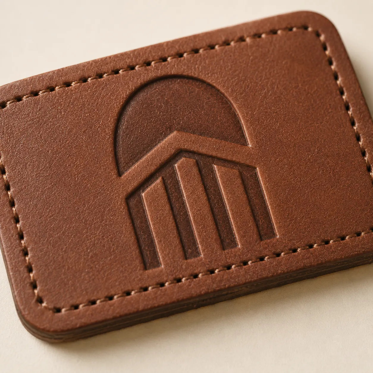Close-up of abstract custom logo area on leather hat patch