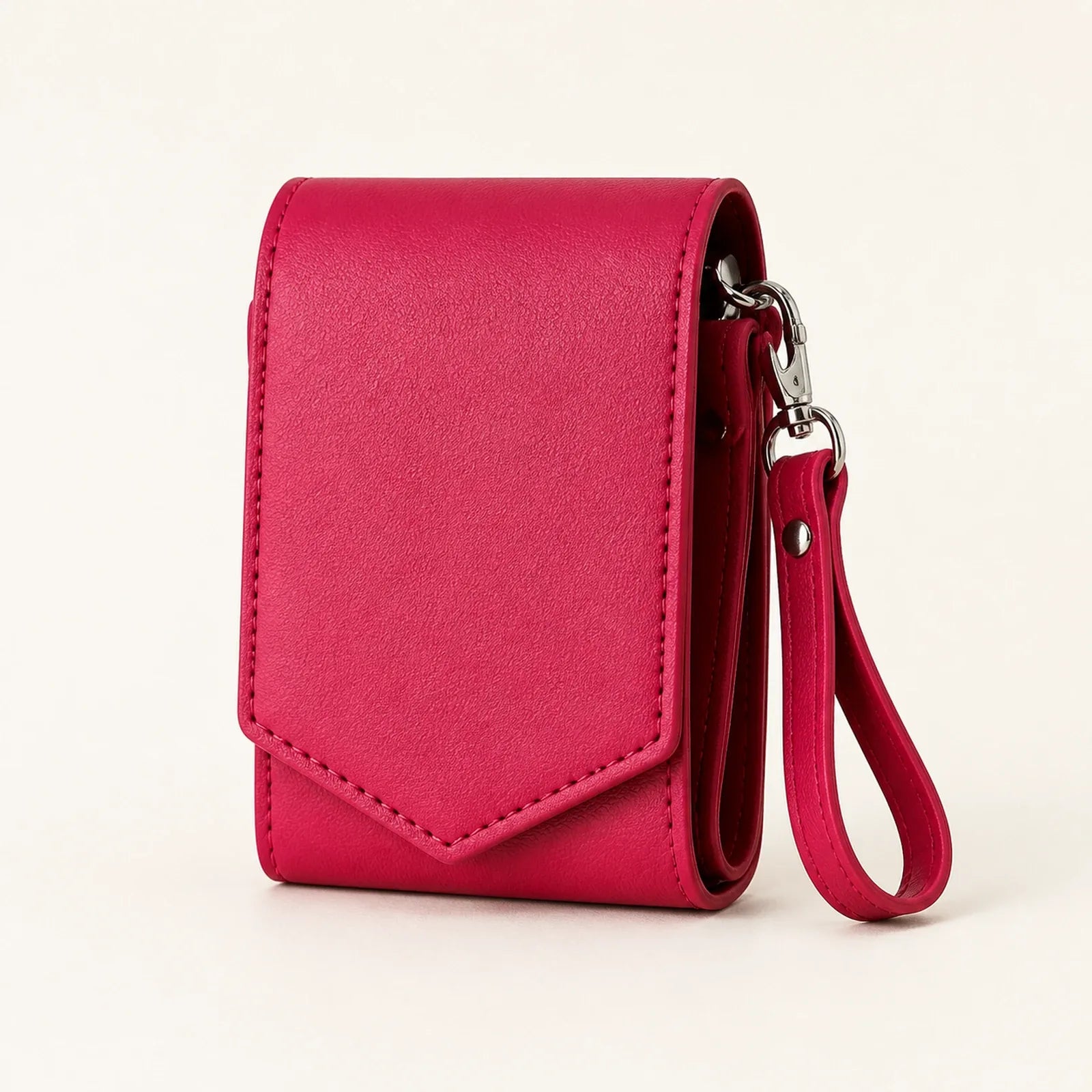 Raspberry pink multi-slot lipstick case with mirror and detachable wrist strap, front view