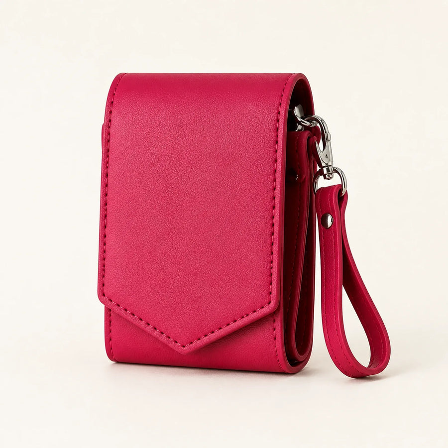 Raspberry pink multi-slot lipstick case with mirror and detachable wrist strap, front view