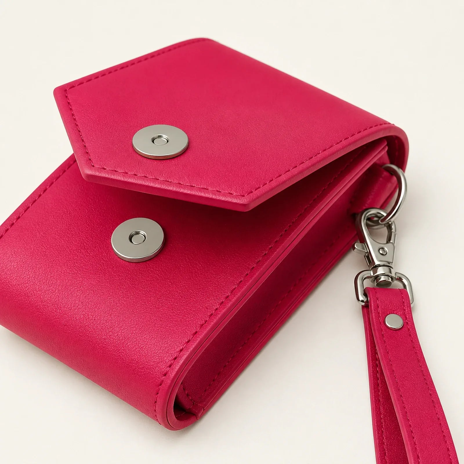 Close-up of magnetic snap and detachable wrist strap hardware