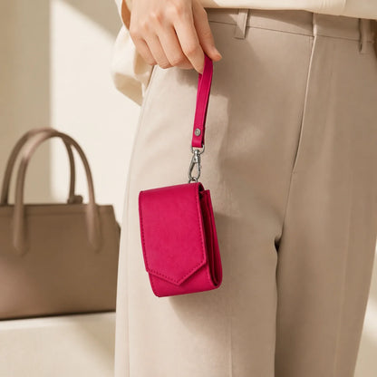 Compact lipstick wristlet case carried by its detachable strap