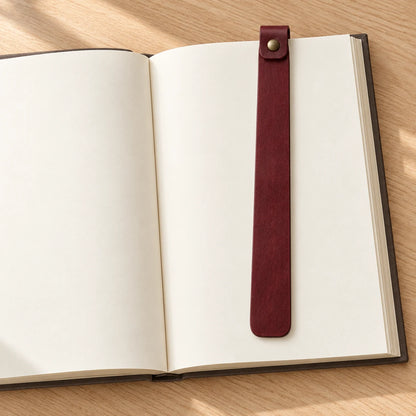 Riveted leather bookmark shown with a book in a reading scene
