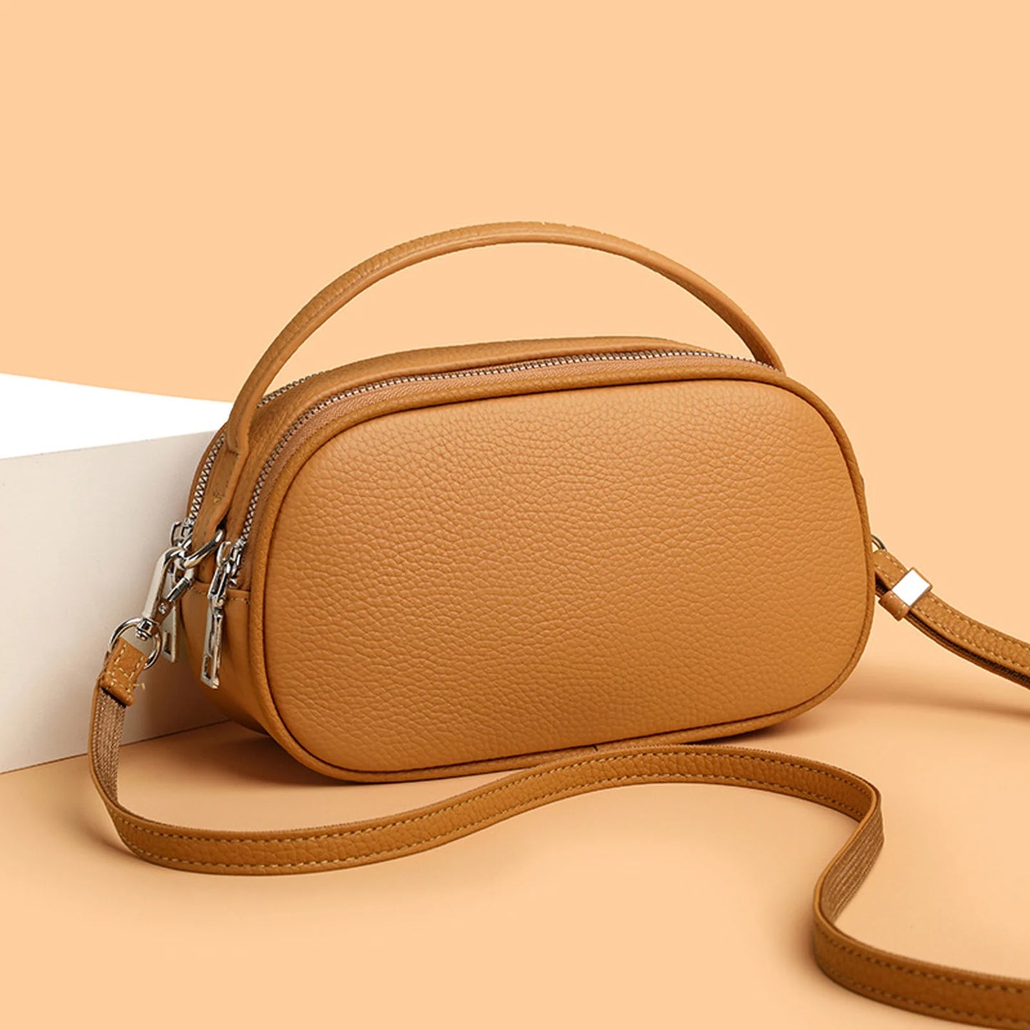 Rounded Camera Crossbody Bag custom OEM reference 453905766 - angled view