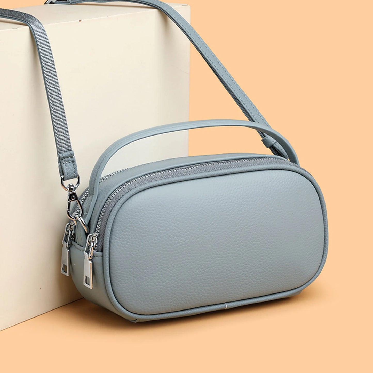 Rounded Camera Crossbody Bag custom OEM reference 453905766 - side or carry view
