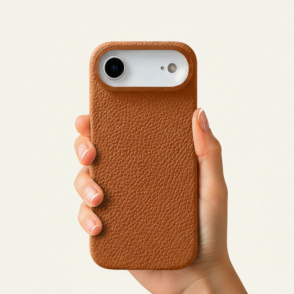 Brown top-grain leather iPhone 17 Air case in-hand view