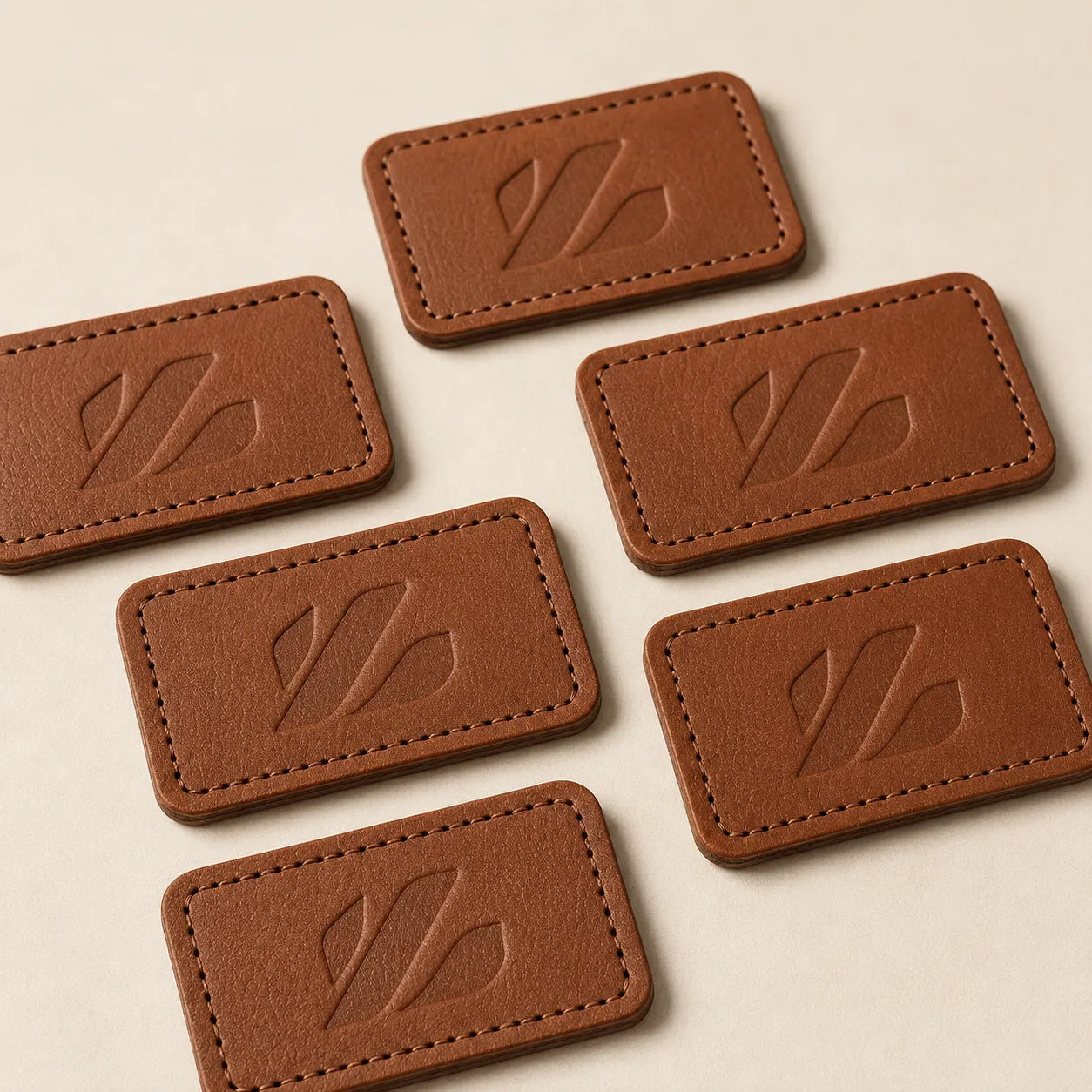 Debossed brown leather patches for hats concept sample for OEM ODM manufacturing