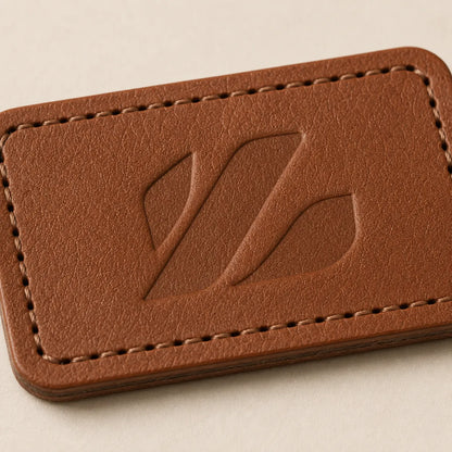 Close-up of blind debossed logo area on brown leather patch
