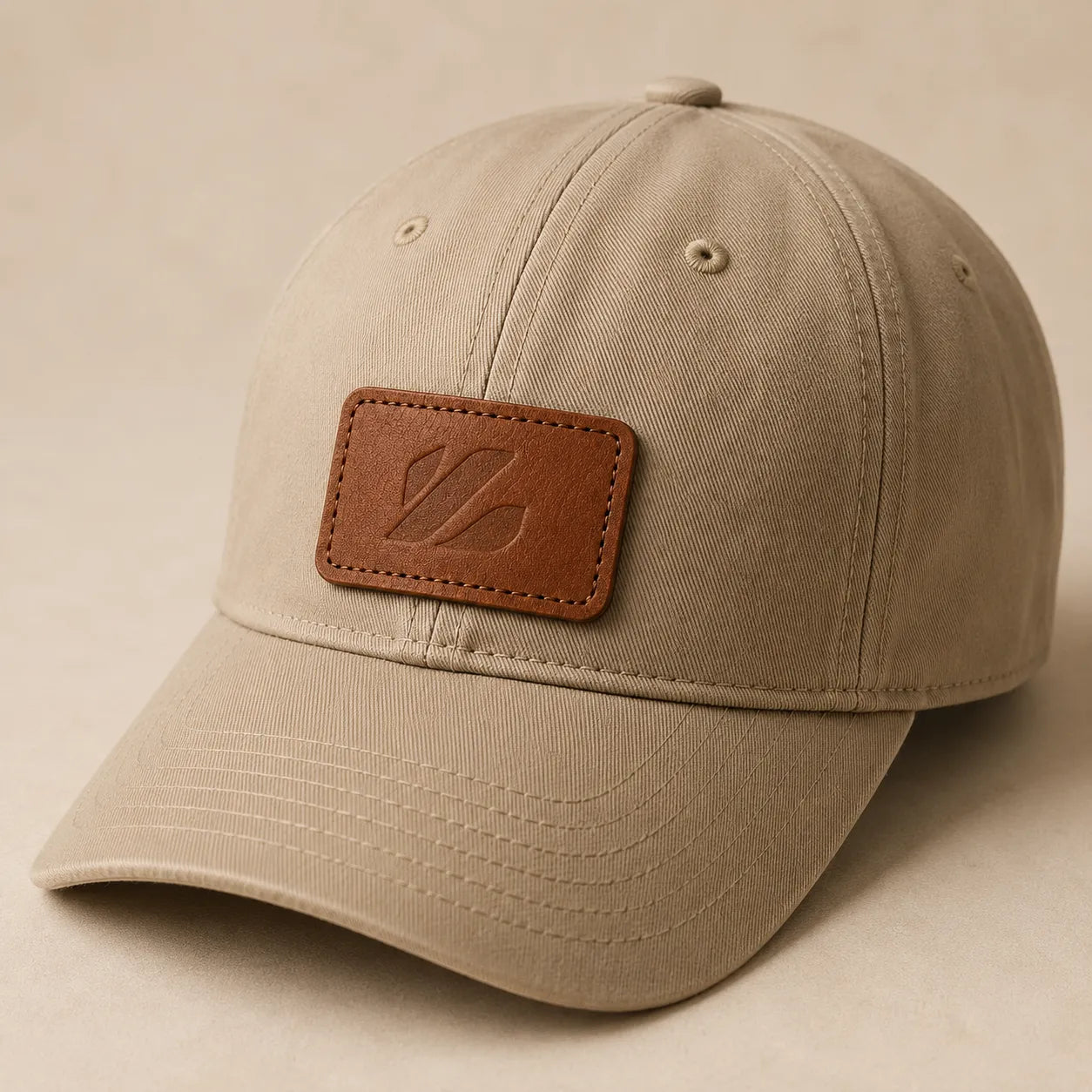Debossed leather patch sewn onto plain neutral baseball cap