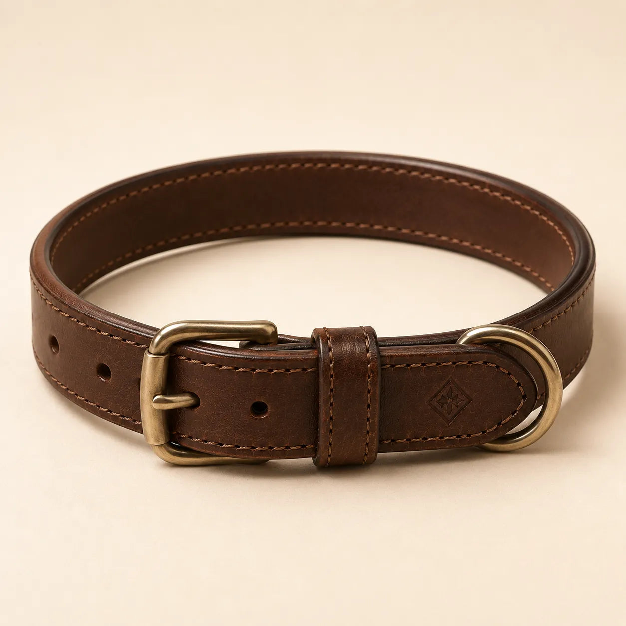 Angled view of brown leather dog collar with subtle debossed logo area