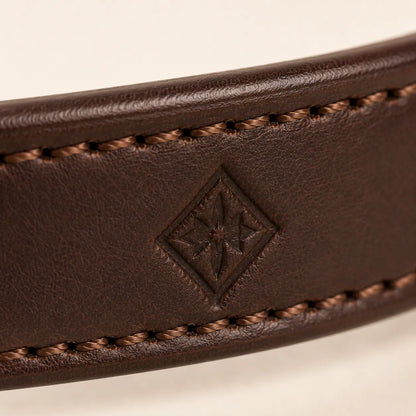 Close-up of blind debossed logo area on leather dog collar
